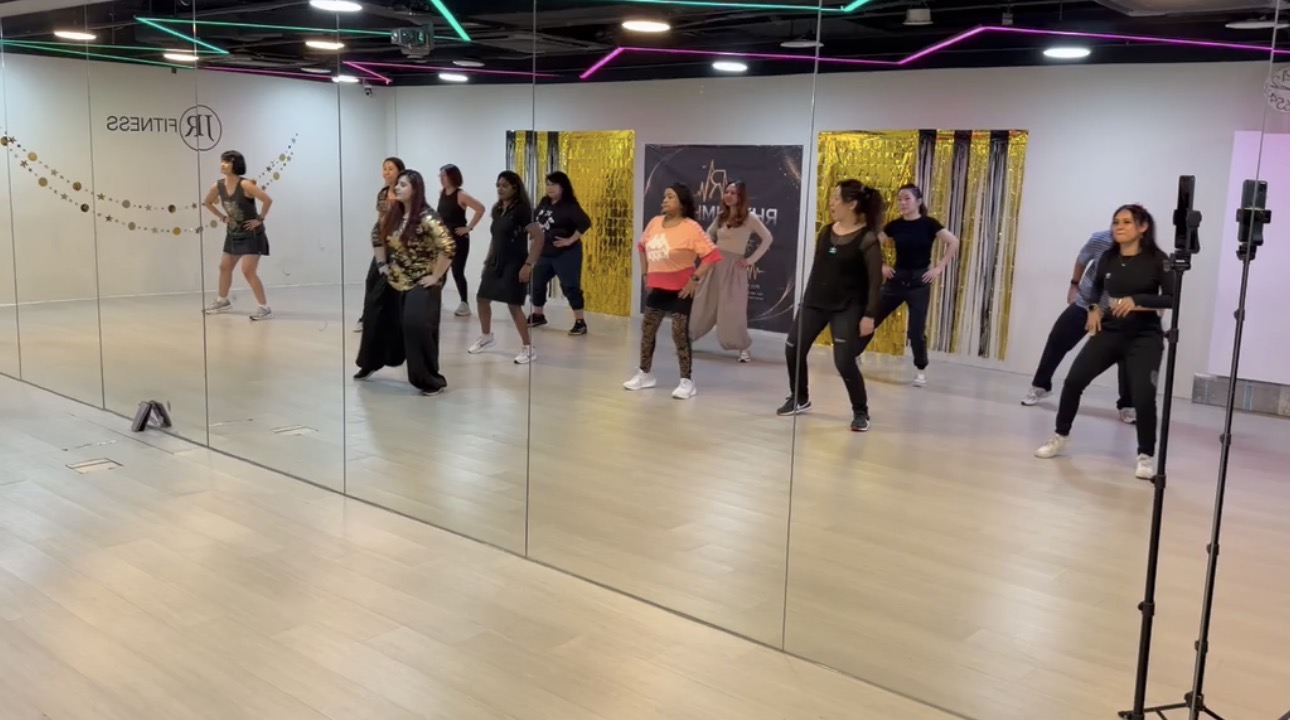 Participants moving together at a RhythmHaus™ studio session