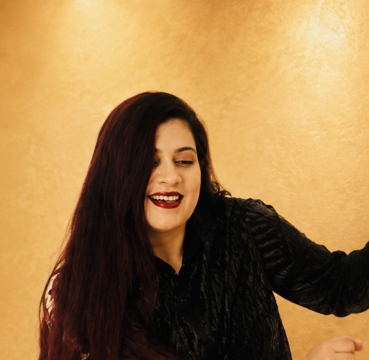 Swati smiling during a dance pose